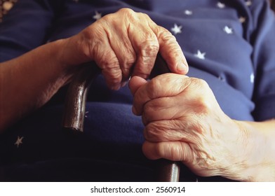 Close-Up of Elderly Woman Holding Cane