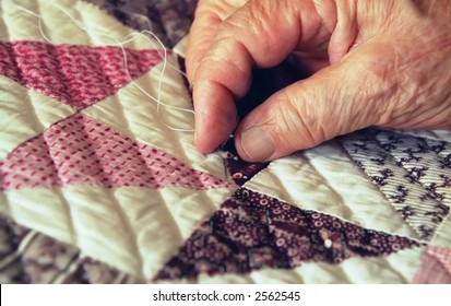 Close-up of Elderly Woman's Hand Busy Quilting