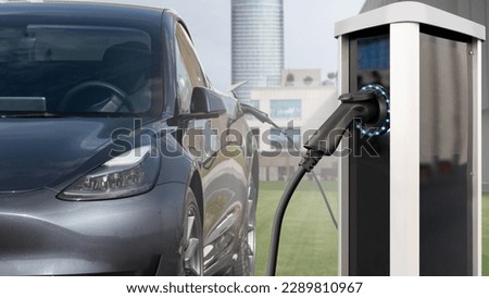 Close-up of an electric car with charging station