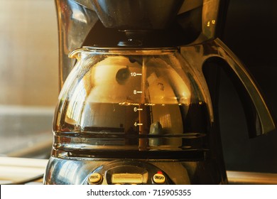 Close-up Of Electric Glass Coffee Pot With Measurer