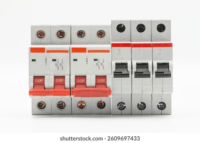 Close-up of electrical circuit breakers isolated on white background, showcasing industrial safety equipment.
