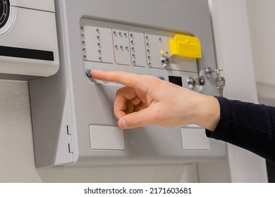 Close-up of electrician Checking Fire Alarm Panel In Datacenter - Shutterstock ID 2171603681