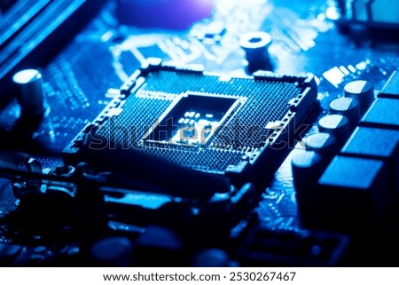 close-up of electronic circuit board processor holder mainboard, computer hardware with dark blue lighting