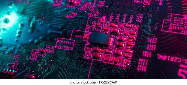Close-up of electronic circuit computer microchips in neon colors