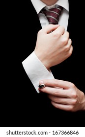 Close-up Of Elegance Male Hands Putting On Cuff Links. Groom's Suit