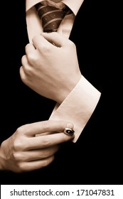 Close-up Of Elegance Male Hands Putting On Cuff Links. Groom's Suit