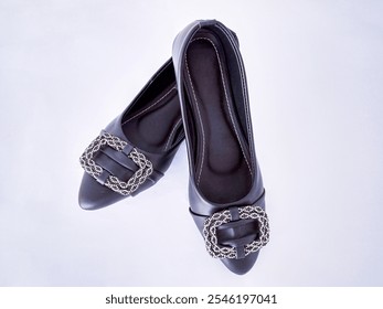 Close-up of Elegant Black Pointed-toe Women's Shoes with Rhinestone Buckles, Isolated on a White Background - Swabi, Pakistan: 16-November-2024 - Powered by Shutterstock