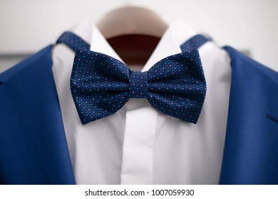 Close-up Elegant Blue Suit With White Shirt And Blue Bow Tie, In Preparation For A Formal Event, Job Interview Or A Wedding Ceremony, Or As Part Of Office Attire