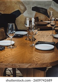 Close-Up of Elegant Restaurant Table Setting with Artistic Wall Background