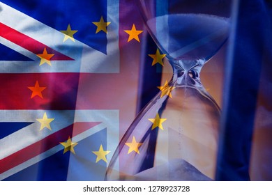 Closeup Elegant Sandglass Counting Down Time To Brexit On Background Of Overlapped Flags Of Great Britain And European Union