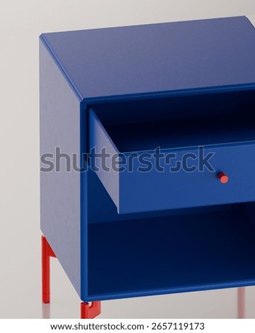 A close-up, elevated view of a bright blue bedside table, highlighting the open drawer with its small red knob and the clean lines of the design.