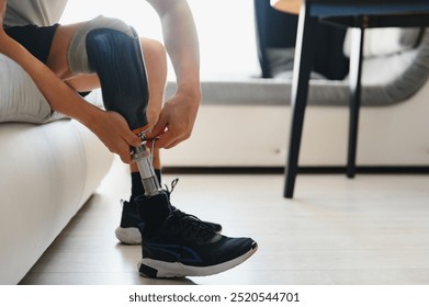 Close-up elevated view of a man adjusting the screws on an artificial prosthetic leg. - Powered by Shutterstock