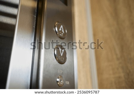 Closeup of elevator buttons in a modern setting, highlighting sleek design and convenience