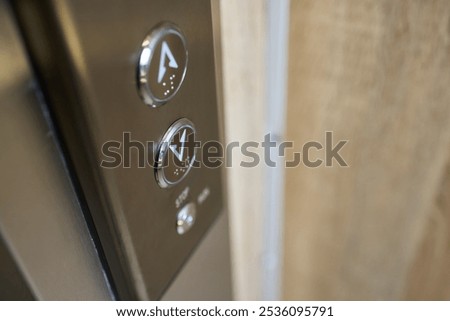 Closeup of elevator buttons in a modern setting, highlighting sleek design and convenience