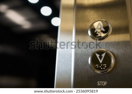 Closeup of elevator buttons in a modern setting, highlighting sleek design and convenience