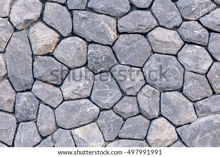 Closeup embed stone pattern in concrete wall