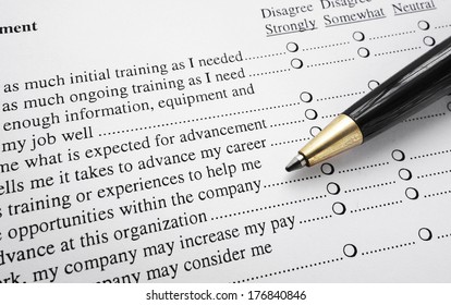 Closeup Of An Employee Survey With Pen                               