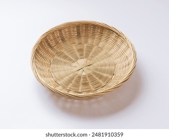 Close-up of an empty bamboo basket on white floor, South Korea
 - Powered by Shutterstock