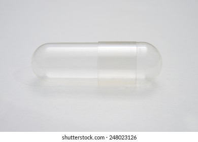 closeup of empty capsules isolated on white background 