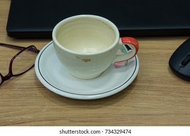 closeup empty coffee cup on computer table