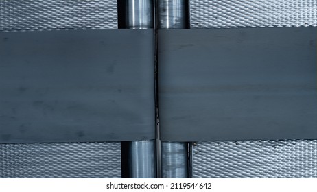 Closeup empty conveyor belt moving at modern automated manufacturing facility. Technological factory warehouse complex mechanical transportation line operating. Automation workplace concept 