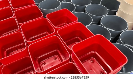 Close-up of empty flower pots in a store or greenhouse. Colorful pots for plants. Gardening and landscape design concept