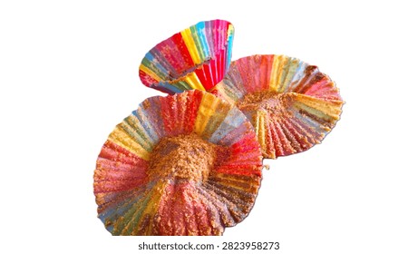 Close-up of empty rainbow paper baking cups after a party, symbolizing community, diversity, and the sweet conclusion of a Pride celebration. Authentic remains of Pride Month baking showing three empty colorful muffin liners, representing a successful celebration of LGBTQ+ love.  A trio of empty rainbow-colored cupcake wrappers on a rustic surface after the cakes have been eaten, celebrating a birthday, anniversary, promotion, happy event.