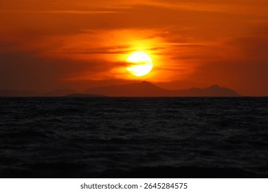 Close-up of empty sky and sun for copy space. The spectacular view of the sunset was breathtaking, with the sun sinking behind the clouds on the horizon.