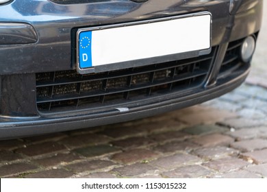 Close-up Of A Empty White Number Plate On dark Car.
Blank Euro License Plate On a Car.
