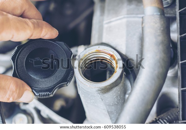 closeup engine\
oil cap in engine room of old\
car