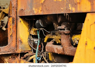 A close-up of the engine on an old crawler tractor