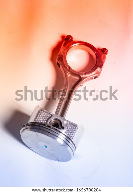 closeup engine piston\
on white background