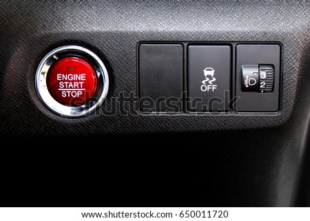 closeup engine start stop button in car