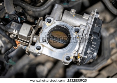 closeup, The engine throttle body regulates the amount of air entering the engine.