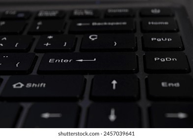 closeup of enter key, selective focus of enter key on notebook keyboard
