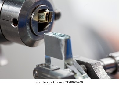 Closeup of an epoxy embedded tissue placed on the ultramicrotome to make sections for the electron microscope