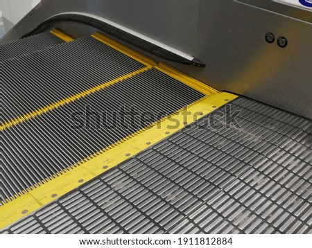 closeup of escalator electronic system at train station.