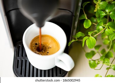 Closeup of espresso coffee in the making in a coffee machine.