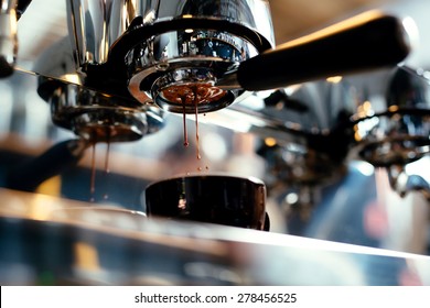 Close-up of espresso pouring from coffee machine. Professional coffee brewing - Shutterstock ID 278456525