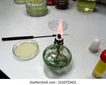 Close-up Of An Ethanol Burner, Also Known As A Spirit Lamp, In A Microbiological Laboratory. Science Concept.