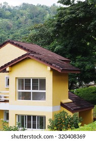 close-up of european and Mediterranean house style colourful house cottage facade with minimal styling windows and roofs in a tropical mountain resort with beautiful hills background in THAILAND
