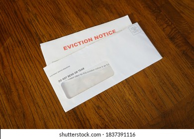 Close-up Of An Eviction Notice In Envelope on Desk - Shutterstock ID 1837391116