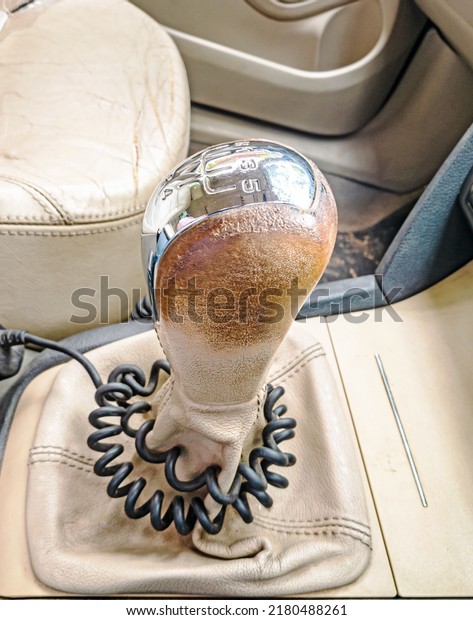 closeup of exotic leather covered gear change \
lever inside an\
automobile