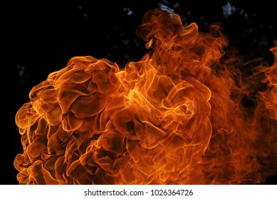 close-up of an exploding orange fireball which shows every detail of the flame