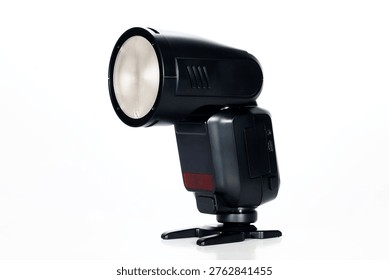 Close-up of an external camera flash used for professional photography, featuring a portable hot shoe lighting accessory designed for studio work, events, portraits, and controlled illumination in various shooting conditions.