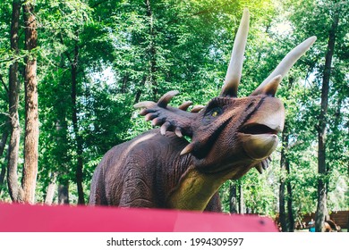 Close-up Of An Extinct Triceratops Dinosaur Made Of Rubber And Metal. Animatronics And Robotics. Animated Models Of Prehistoric Creatures.