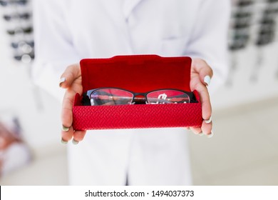 Close-up of eyeglasses in red case