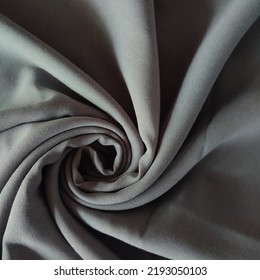 Closeup Fabric Texture Shaped Like A Tornado Symbol