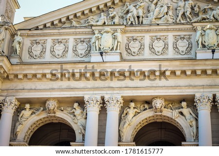 closeup facade of Lviv opera and ballet theatre with different marble sculptures with detailing