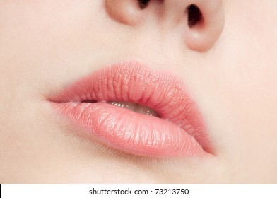 Close-up face of beauty young woman - lips make-up zone